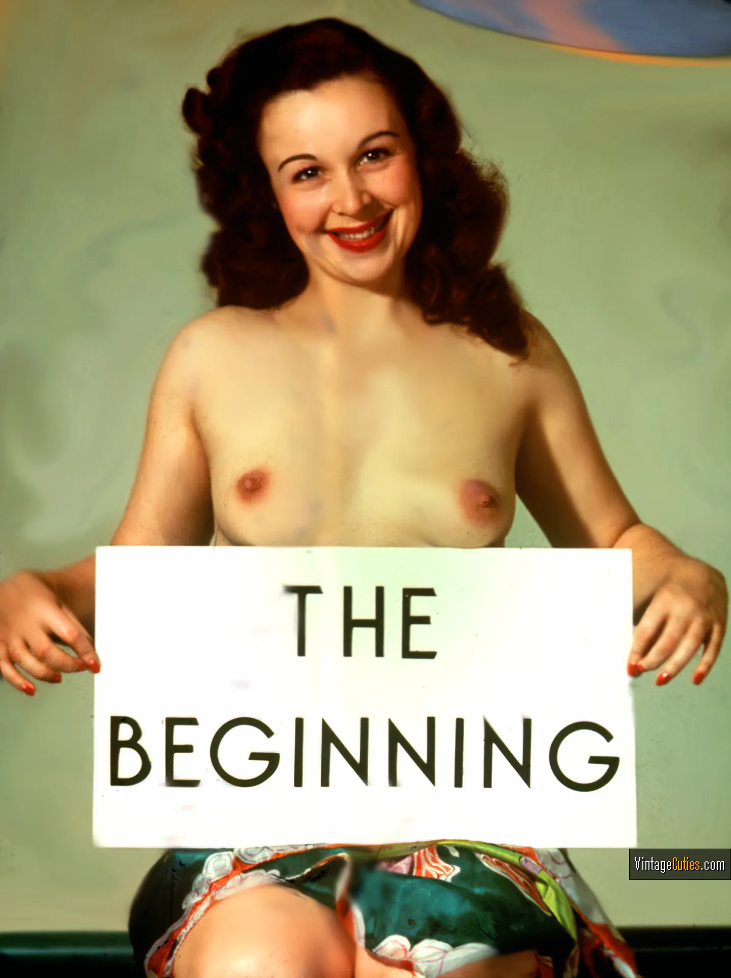 Adorable Bebe Berto with tiny breasts holding a sign